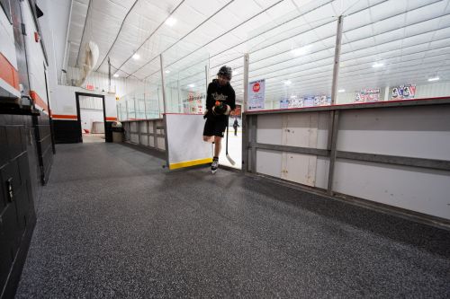 a skater leaves the ice to a protective surface for skates