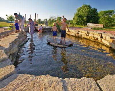 children play in a wet area